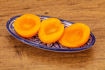 Marinated peaches fruit in the bowl