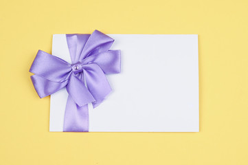 Invitation card with bow for holiday.