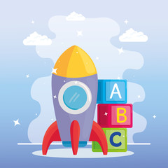 Obraz premium kids toys, rocket and alphabet cubes vector illustration design