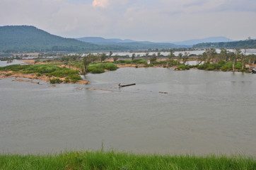 Cataract island in the wide river in southeast of Thailand