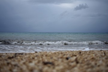 Fototapeta na wymiar Sea waves crashing on the beach on stormy day 