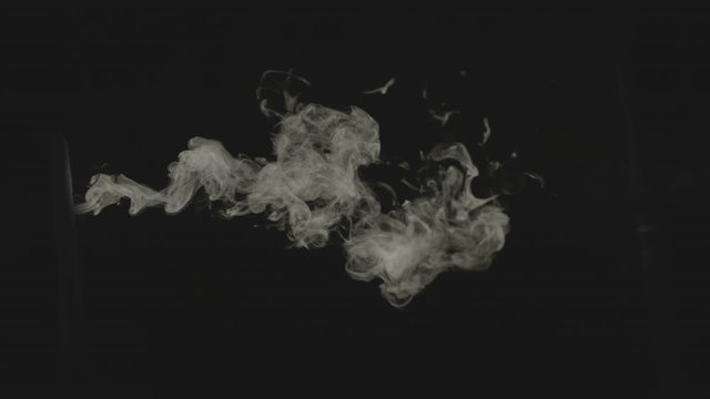 White steam smoke over the black background 
Different steam shapes to be used in shoots that’s need add smoke on a tea pod or mount steam of could .

