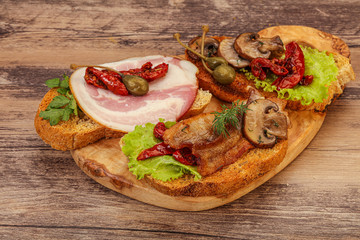 Italian appetizer - bruschetta mix with meat