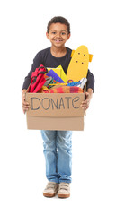Little African-American boy with donations on white background