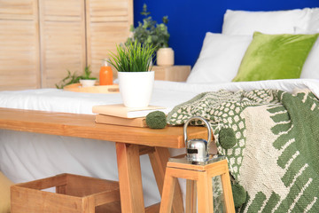 Big bed and bench in interior of modern room