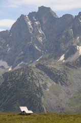 Group of hikers on the mountains walking against the sun.