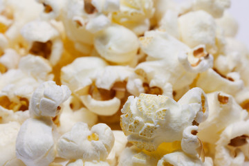 lots of yummy popcorn on white background