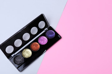 Modern eyeshadows on color background