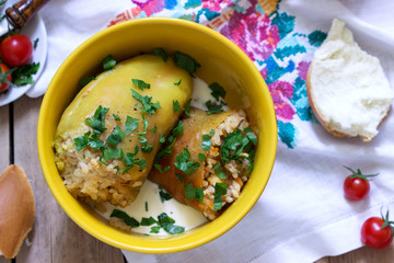 Stuffed peppers served with sour cream and bread, a traditional dish of different nations.