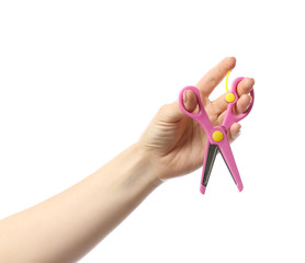 Female hand with scissors on white background