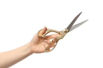 Female hand with tailor's scissors on white background