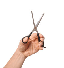 Male hand with hairdresser's scissors on white background