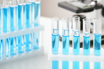 Test tubes on table in laboratory, closeup