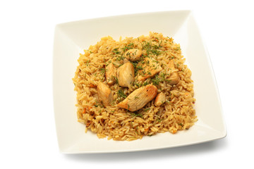Plate with tasty pilaf on white background