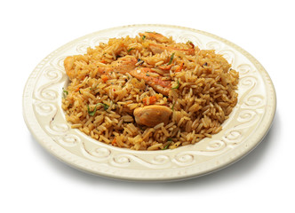 Plate with tasty pilaf on white background