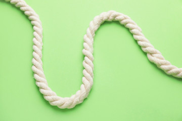 Long rope on color background