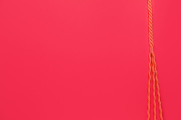 Long rope on color background