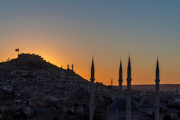 View of Nevsehir Castle at sunset with Turkish flag in Kayasehir