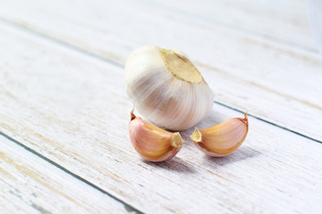 Garlic on a white background. Garlic Cloves in vintage wooden bowl. Garlic banner.