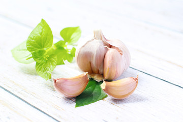 Garlic on a white background. Garlic Cloves in vintage wooden bowl. Garlic banner.