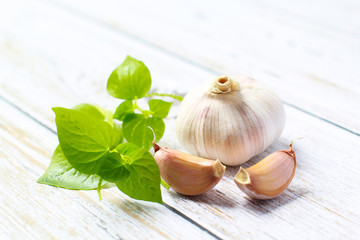 Garlic on a white background. Garlic Cloves in vintage wooden bowl. Garlic banner.
