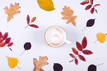 Fototapeta na wymiar Autumn Fall Background with leaves and cup of coffee. Hello Autumn card concept.