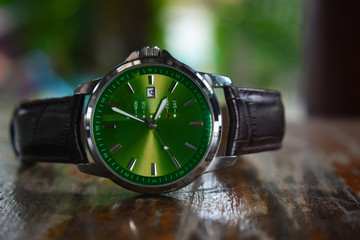 
Wrist watch
 Green dial leather strap