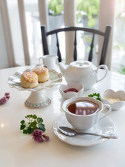Breakfast tea set with fresh cookies, butter, jam. Good morning.