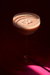 Pina Colada - Tropical Cocktail with Kahlua, Coconut Milk and Rum. Fresh Summer Drink on purple background