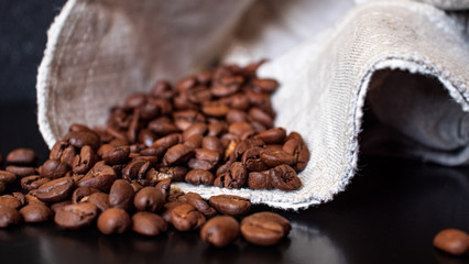 coffee beans are scattered on the table next to the cloth