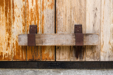 Old wooden door locked with wooden bar. Wooden Door Latches for Wood. 