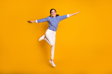 Fototapeta na wymiar Full size photo of nice cute sweet girl jump hold hand enjoy summer weekend free time wear good look outfit isolated over bright color background