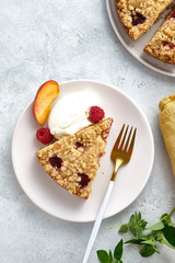 Raspberry and crumble pie. Fresh dessert fruit tart covered in raspberries.