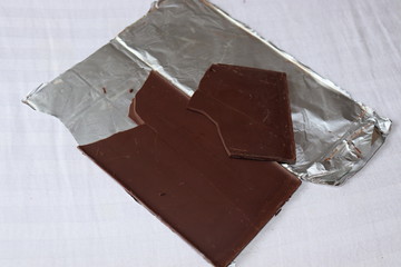 An unpacked piece of single origin dark chocolate sold in the market.