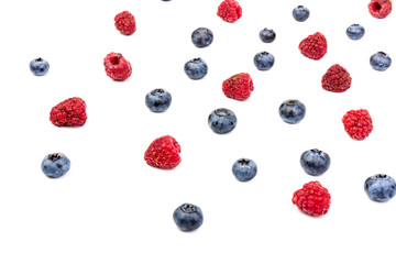 raspberries and blueberries isolated on white background