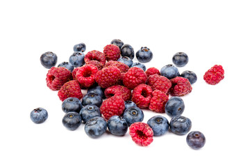 raspberries and blueberries isolated on white background