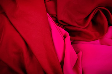 Pieces of pink and red textile or fabric