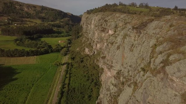 Flying over train tracks, next to Rock Cliff at Suesca in Colombia. A climbers paradise for rock climbing.