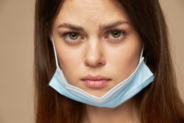 Sad woman open face medical mask health problems model portrait 