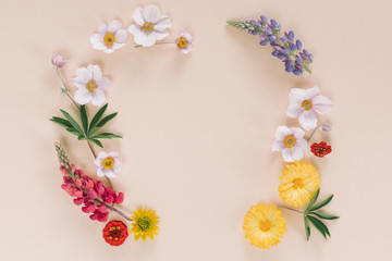 Wreath of flowers. Elegant floral composition with space for text or logo in the centre. Branding mock up, holiday marketing concept.
