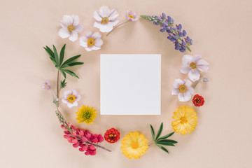 Elegant floral composition with paper blank in the centre. Branding mock up, holiday marketing concept.