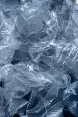 Rolled plastic bottles for recycling.