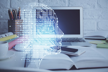 Double exposure of work space with computer and human brain drawing hologram. Brainstorm concept.