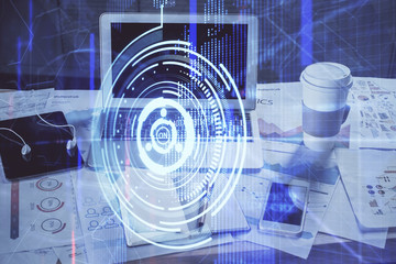Double exposure of laptop computer and technology theme hologram. Concept of freelance work.