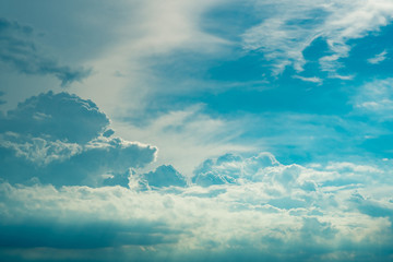 Heaven sky and white clouds. Blue sky and white fluffy clouds with sun light. Beautiful natural...