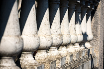 Close-up of an old Balustrade in White Stone, Diminishing Perspective and Selective Focus. Italy, Europe