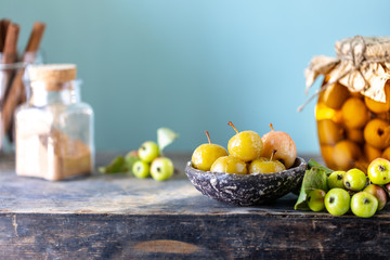 Paradise apple jam. Paradise apples in sugar syrup on an old wooden background. Harvesting the autumn harvest. Copy space.