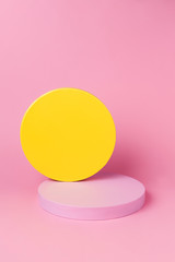 Abstract geometry shape pink and yellow color podium on pink color background for product. Minimal contemporary concept.