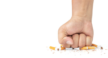 Man hand smash cigarette on white background, Man's fist crushing cigarettes, Stop smoking initiative concept of breaking cigarettes, World no tobacco day..