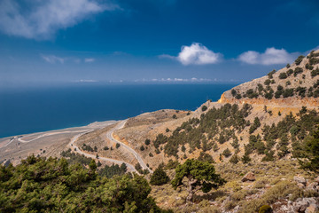 Fototapeta na wymiar Mountains with a road in the background of the sea